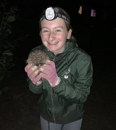 Poppy holding a hedgehog