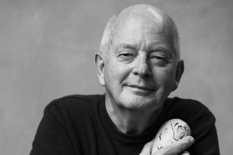 A black and white photo of Tim Birkhead facing the camera