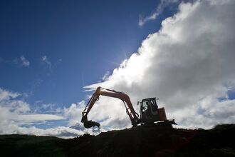 A bulldozer digging up earth