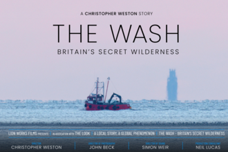 A film poster for The Wash: Britain's Secret Wilderness, showing a red trawler on the sea against a pink background