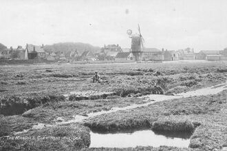 A grainy black and white photo of Cley Marshes. 
