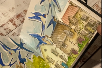 An image of pop-up paper swallows flying past colourful houses