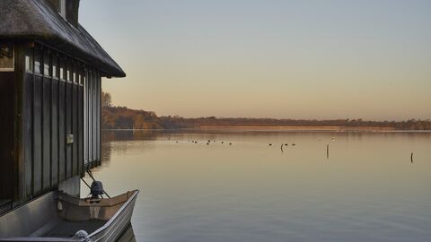 A view across Ranworth Broad at sunset, beside the visitor centre