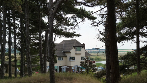 Holme Dunes Visitor Centre viewed through some trees