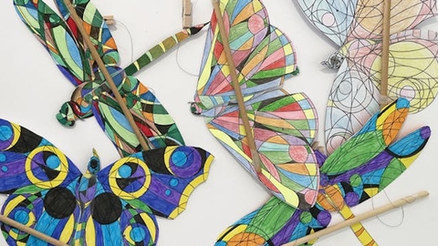 Picture of brightly coloured winged automata