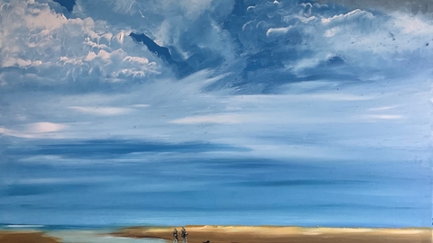 Beach scene with large stormy sky