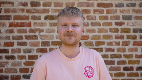 Picture of James McDermott with a brick wall background