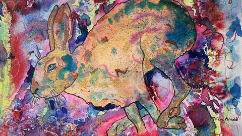 A splotchy, colourful, watercolour painting of a rabbit. 