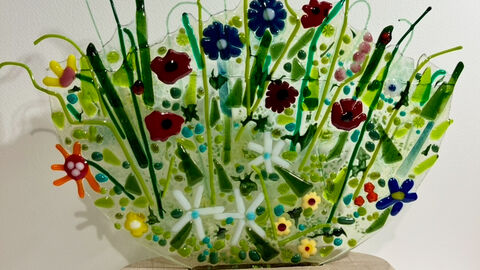 Flower sculpture on a wooden base