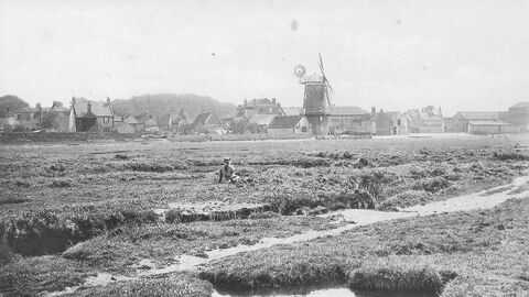 A grainy black and white photo of Cley Marshes. 