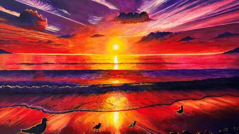 A vivid sunset painting, with a sky of purples, reds, ornages and yellows, with a reflextion across the sea and onto the beach where seabirds are silhouetted on the sand