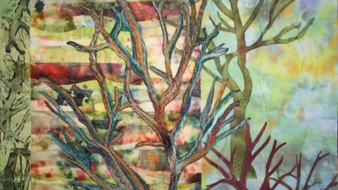 Trees textile artwork, with bare branches against a multi-coloured background