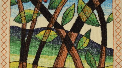 A woven tapestry depicting brown trees, green leaves and a winding stream