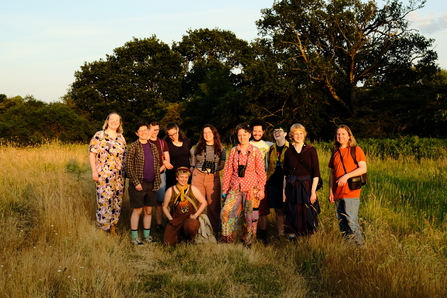 A group of smiley people at Sweet Briar as the sun sets. 