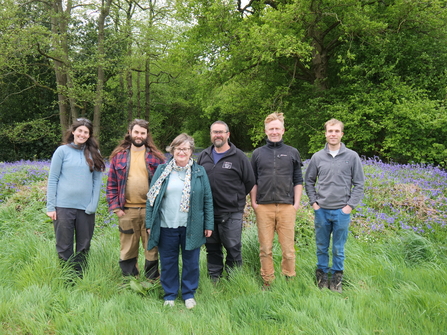 A group of smiley people posing at Foxley Wood