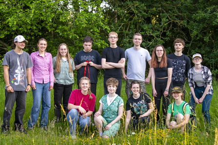 A group photo of our youth forum, posing at Sloughbottom Meadows. 