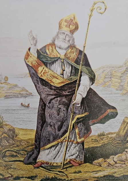 An old drawing/painting of a priest stepping on a snake. 