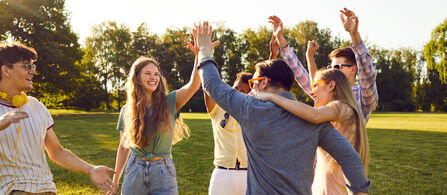 a group of happy people high-fiving