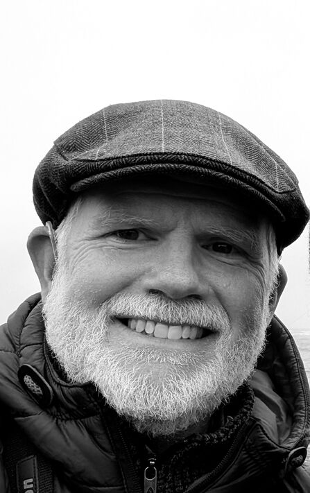 Artist David Prince smiles at the camera