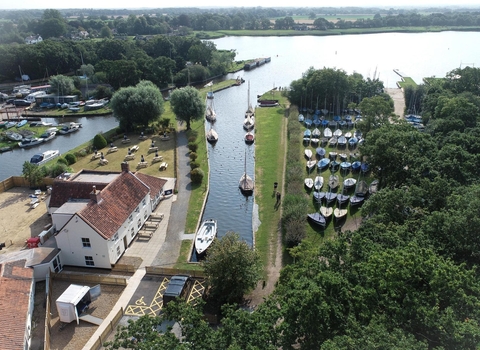 Aerial view of the Pleasure Boat Inn with views of Hickling Staithe and the wider broad